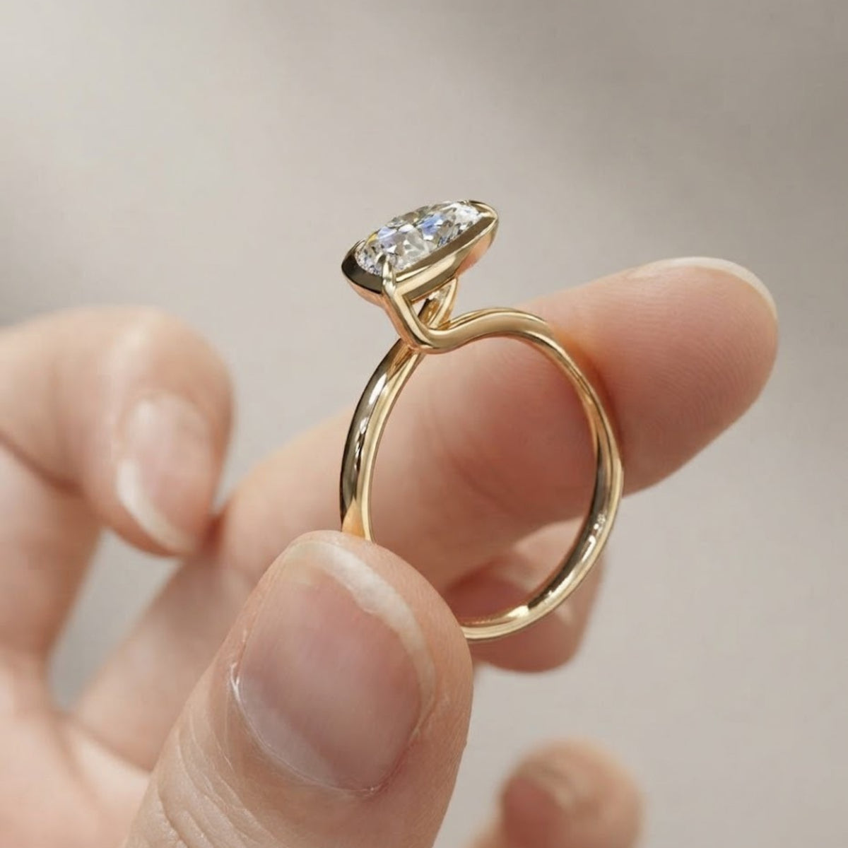 Pear Cut Bezel Set Moissanite Engagement Ring in Yellow Gold