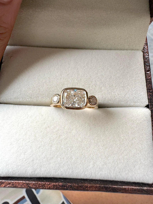 East-West Cushion Cut Bezel Set Moissanite Engagement Ring
