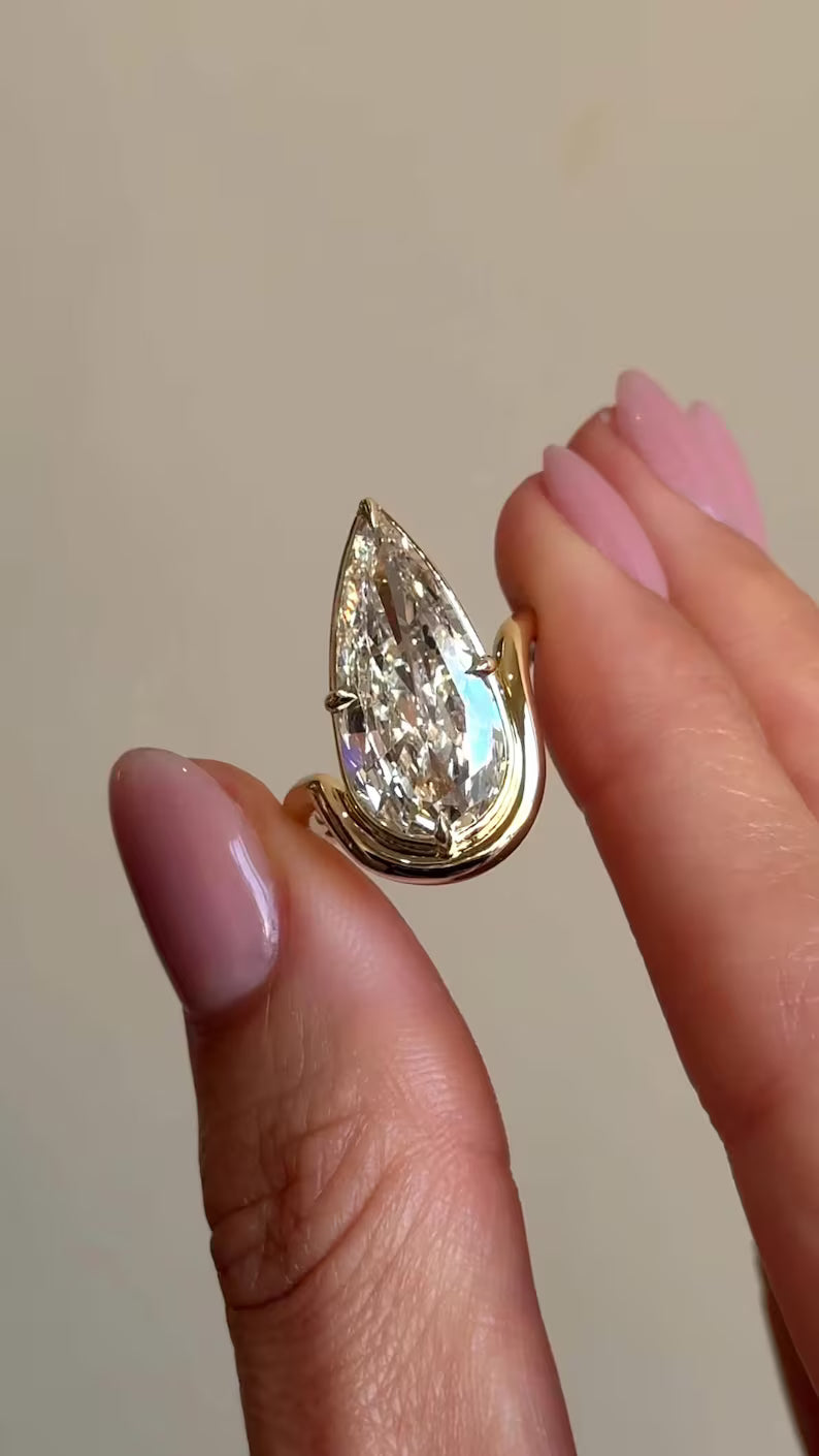 Modern Pear Cut Diamond Engagement Ring - Floating Half-Bezel Curved Band