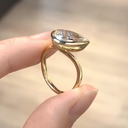 Pear Cut Bezel Set Moissanite Engagement Ring in Yellow Gold