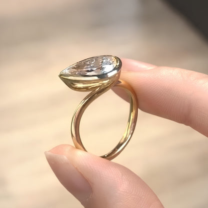 Pear Cut Bezel Set Moissanite Engagement Ring in Yellow Gold