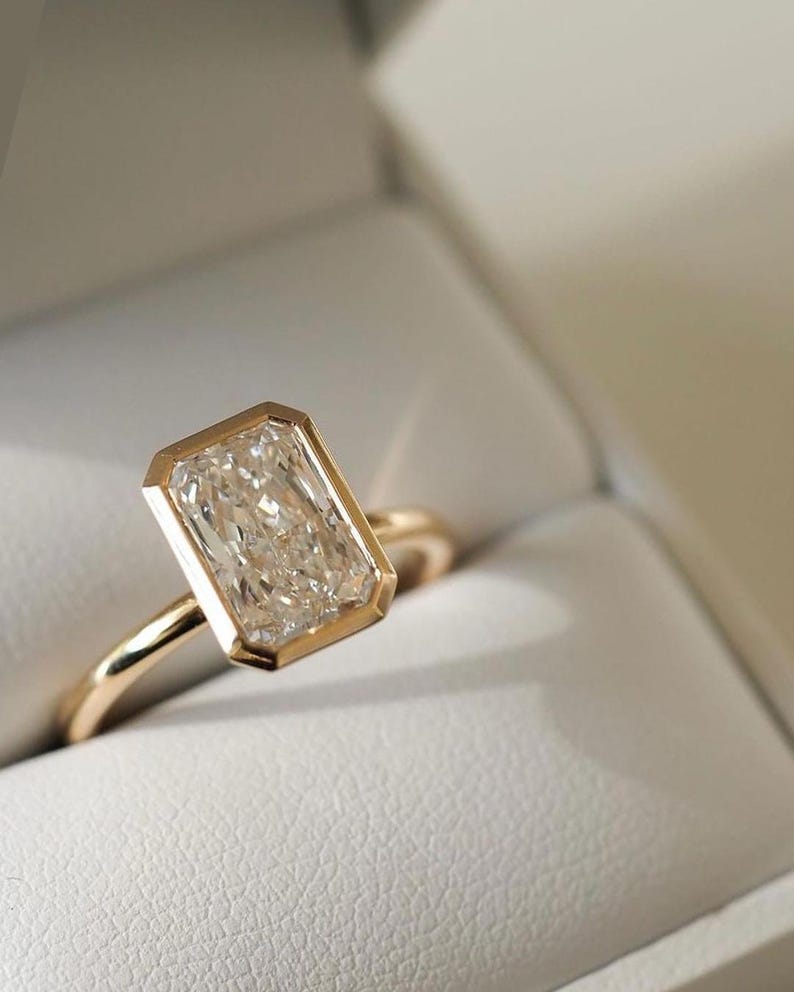 Elongated Radiant Cut Bezel Set Moissanite Solitaire Engagement Ring