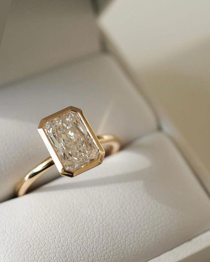 Elongated Radiant Cut Bezel Set Moissanite Solitaire Engagement Ring
