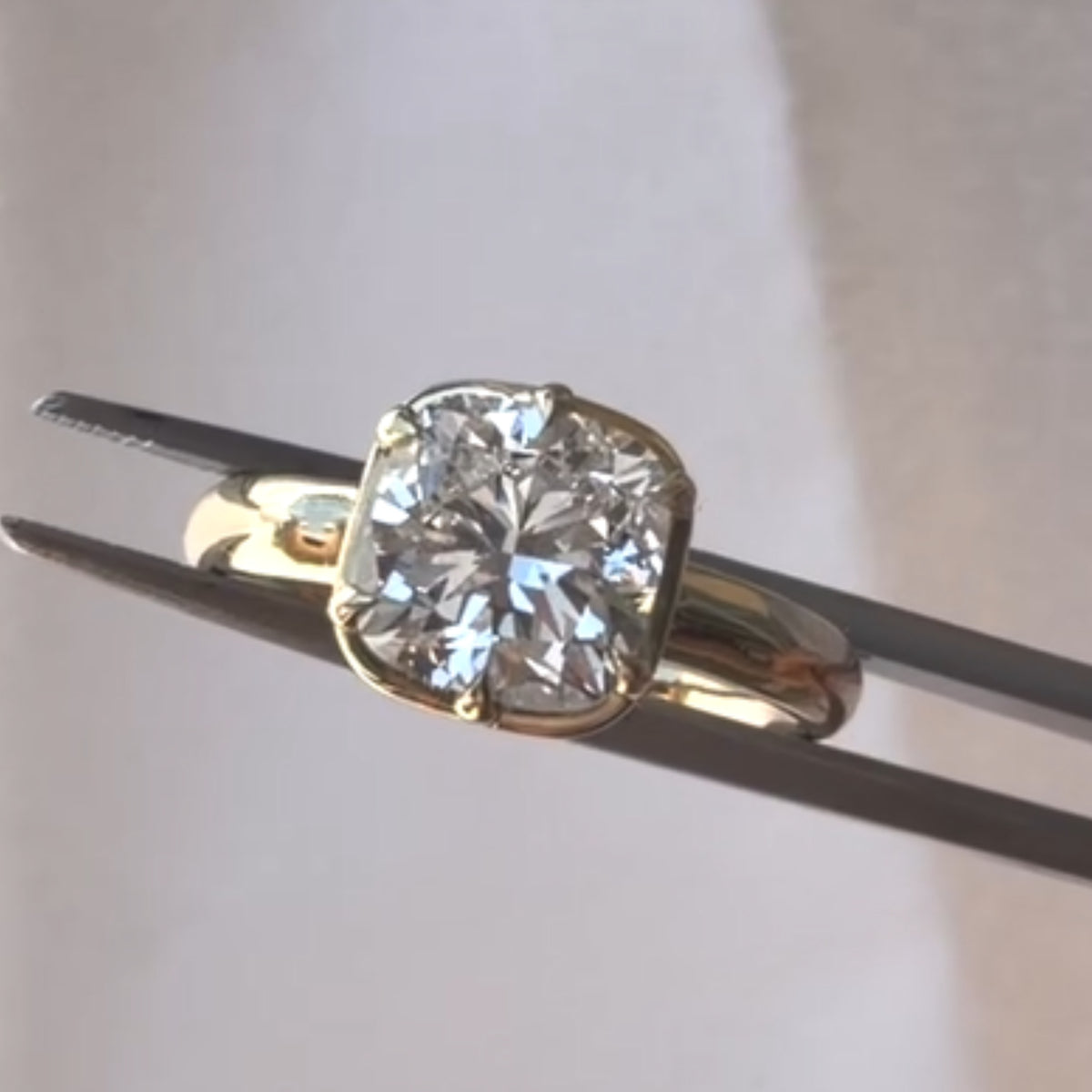 East West Cushion Cut Bezel Moissanite Engagement Ring in Yellow Gold