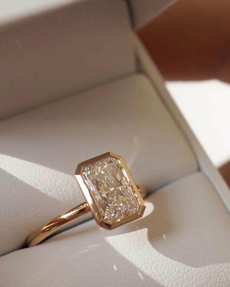 Elongated Radiant Cut Bezel Set Moissanite Solitaire Engagement Ring