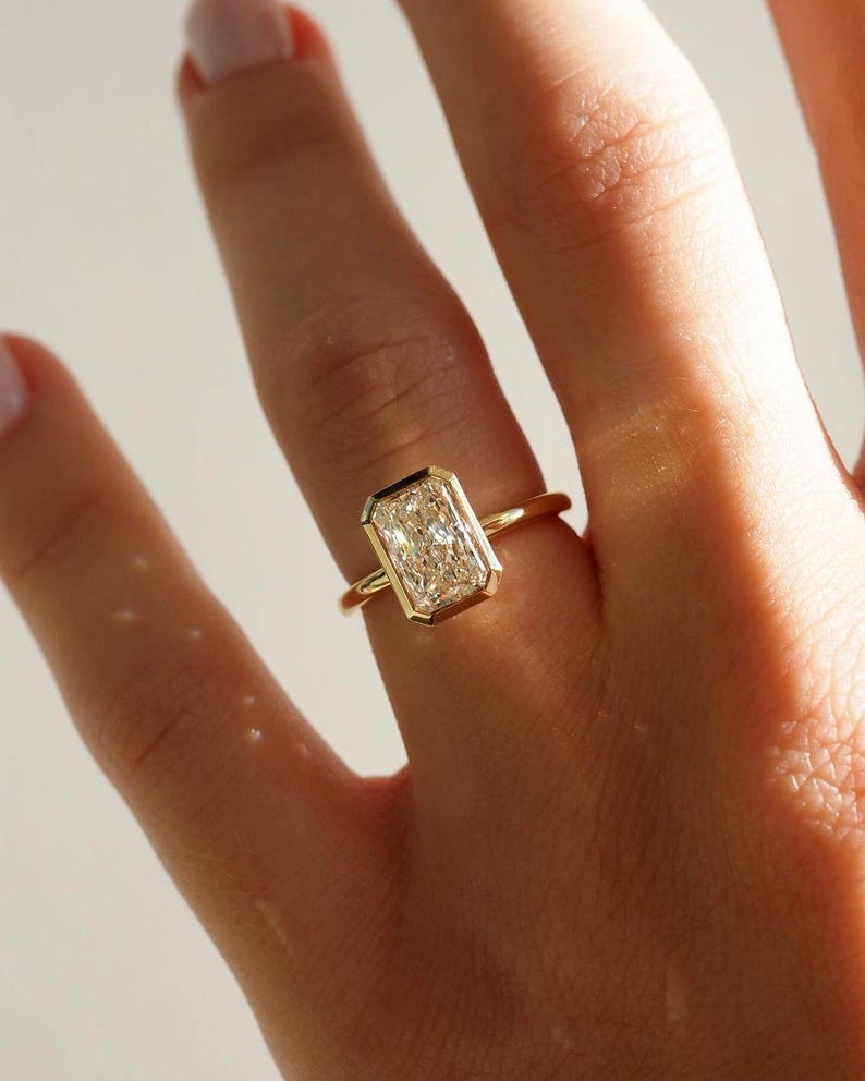 Elongated Radiant Cut Bezel Set Moissanite Solitaire Engagement Ring