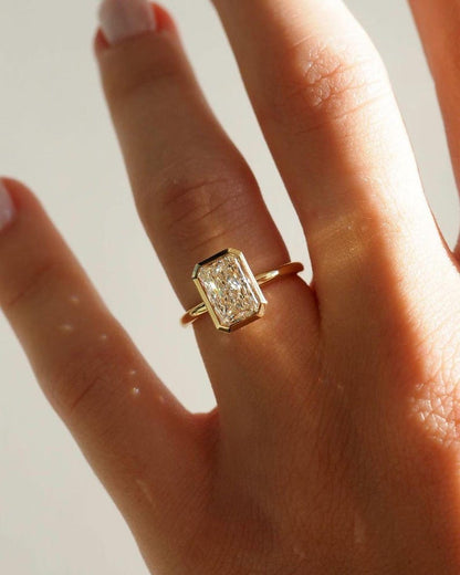 Elongated Radiant Cut Bezel Set Moissanite Solitaire Engagement Ring