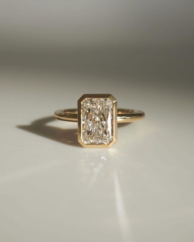 Elongated Radiant Cut Bezel Set Moissanite Solitaire Engagement Ring