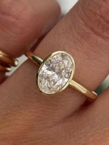 Bezel Set Oval Cut Moissanite Solitaire Ring - Sleek Minimalist Gold Engagement Ring