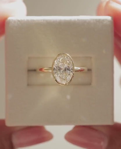 Bezel Set Oval Cut Moissanite Solitaire Ring - Sleek Minimalist Gold Engagement Ring
